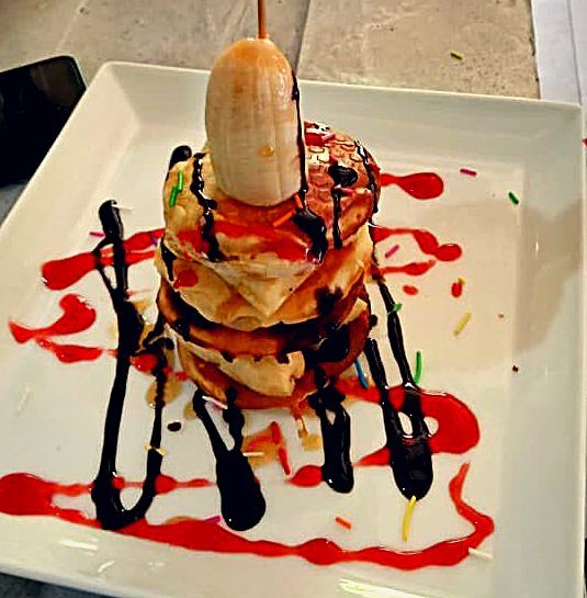 Artfully plated dessert with chocolate and berry
