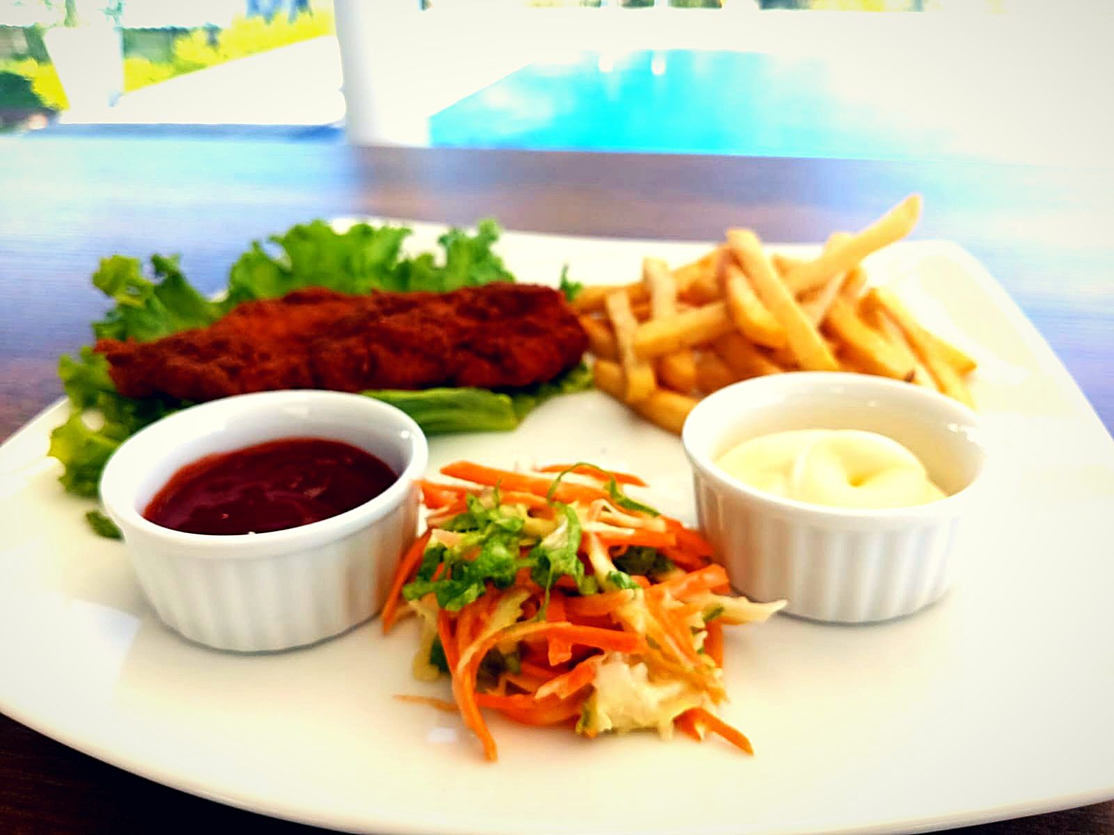 Crispy fried platter with fries, salad and dips