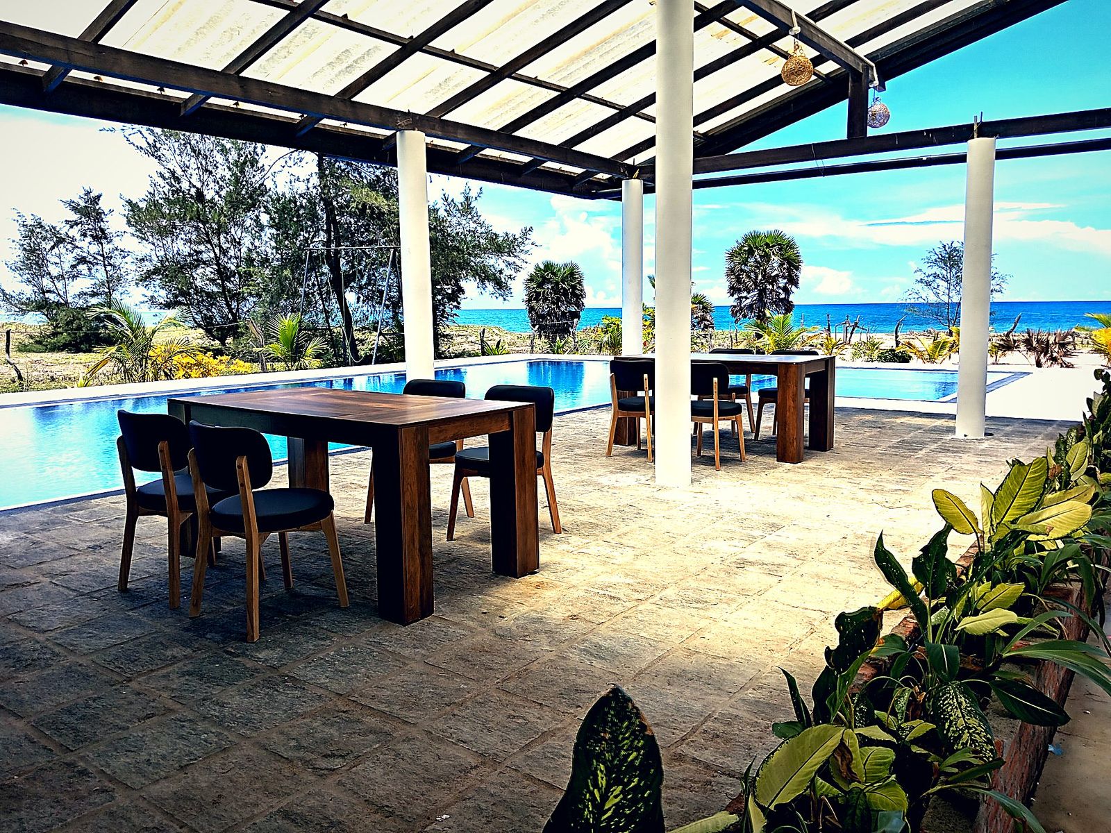 Open-air games lounge with a pool table