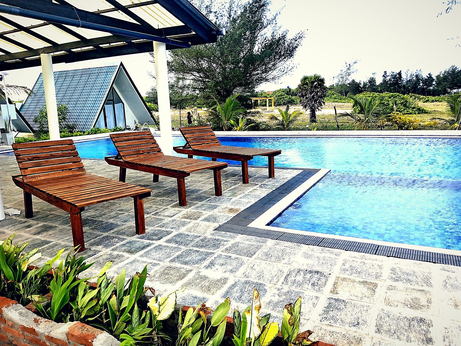 Infinity pool and villas in afternoon light