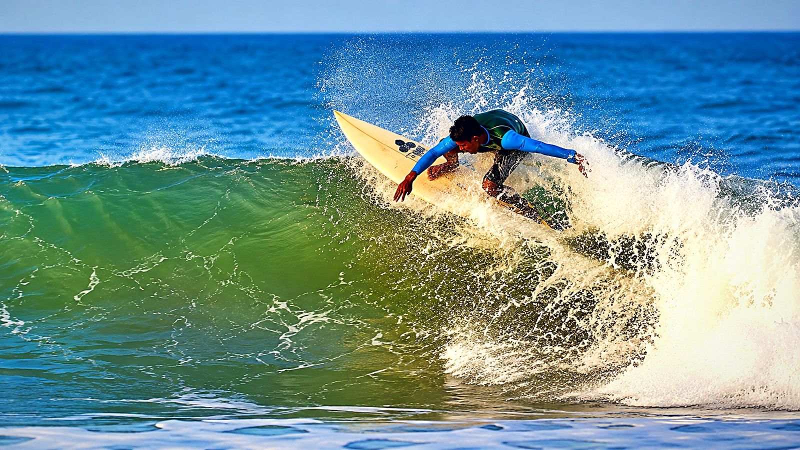 A surfer on a clean wave at Arugam Bay